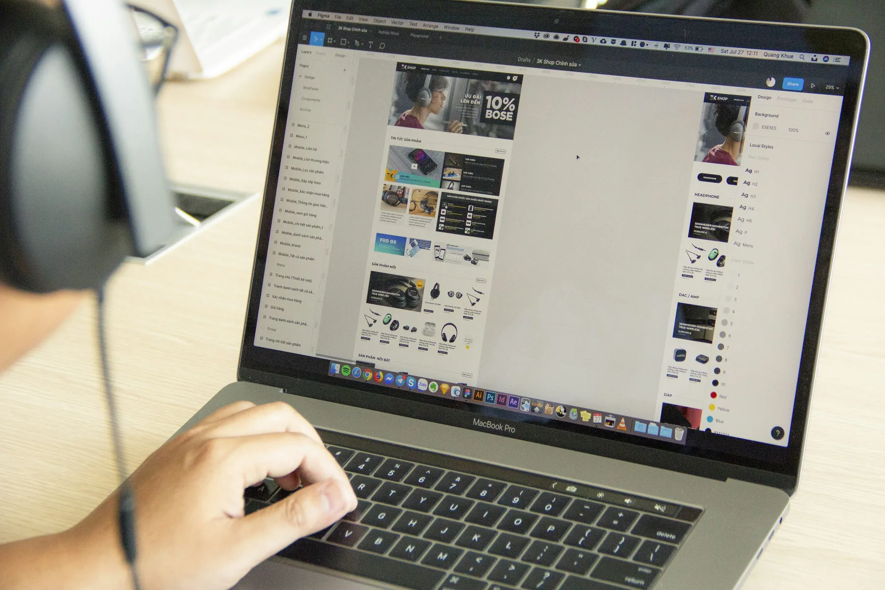 A person working at a laptop on a design interface. Illustrative stock photography.